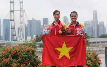 Bộ đôi Phạm Thị Thảo (trái) - Tạ Thanh Huyền thi đấu xuất sắc tại Vòng loại Olympic 2016.